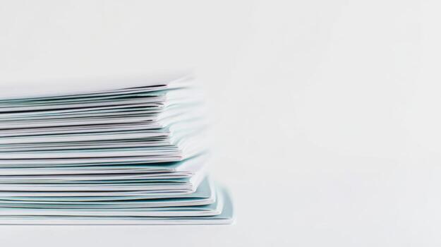 Stack of white papers on a white background photo