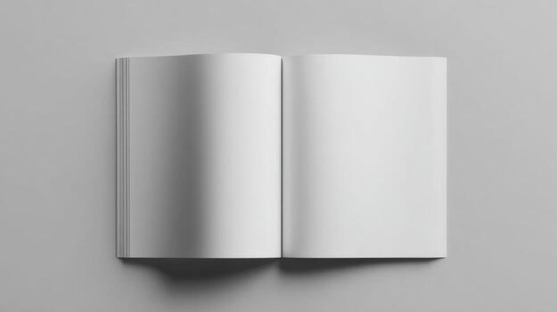 Open book with blank pages against a gray background photo