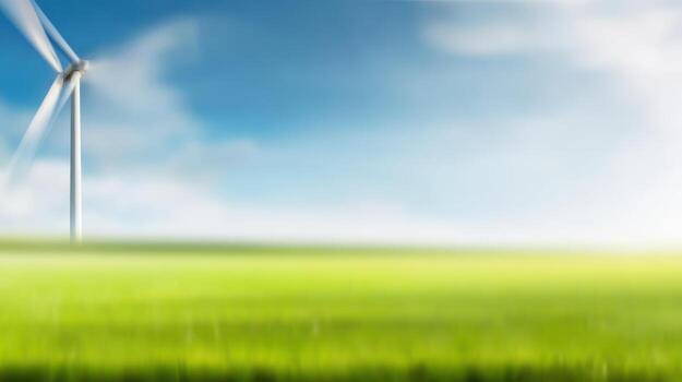 wind turbine in green field with blue sky photo