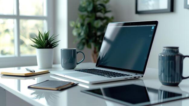 Modern home office setup with laptop, tablet, notebook, pen, and mugs by the window, inspiration photo