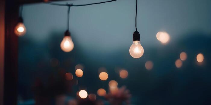 A close up view of glowing string lights creating a cozy ambient atmosphere at dusk photo