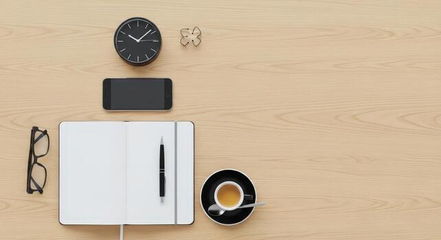 A notebook, phone, glasses, and a coffee cup on a wooden table top view photo