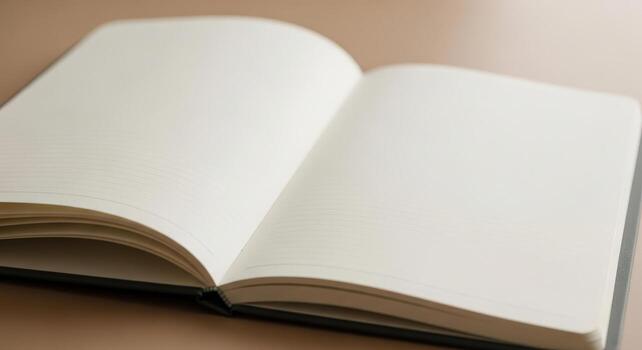 An open book with blank pages on a table photo
