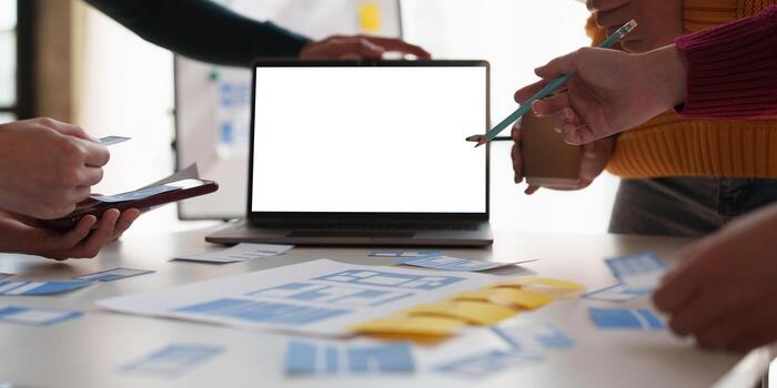 Group of ux developer and ui designer brainstorming about app interface design at modern office. Creative digital development agency photo