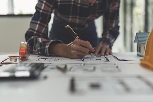 Professional architect designer structural engineer working with blueprint design project photo