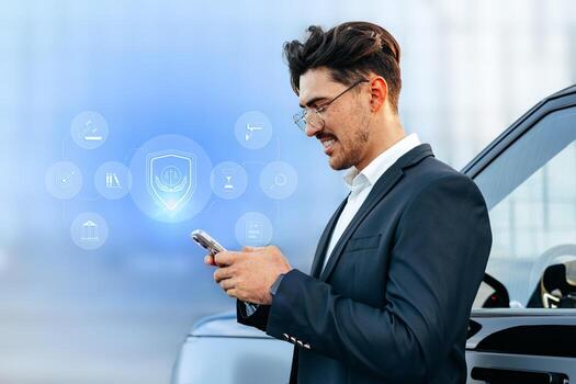 Person using smartphone while standing next to a car in a modern setting photo