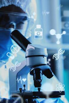 Scientist using a microscope to explore biological samples in a modern laboratory setting photo