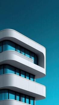 A modern building with a blue sky background photo