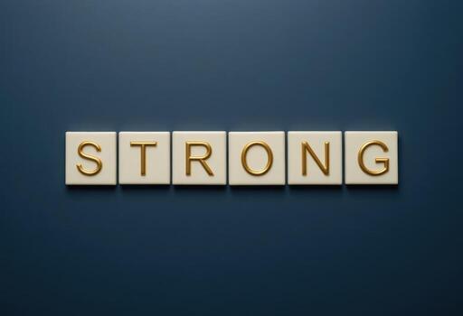 Elegant Typography of the Word Strong in Gold on Dark Background photo