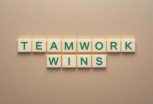 Inspiring Message of Teamwork Wins Displayed with Letter Blocks on Background photo
