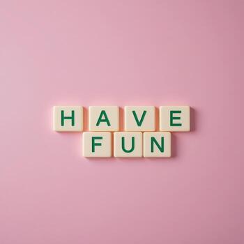 Playful Message on Pink Surface Have Fun in Alphabet Tiles photo