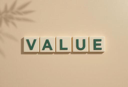 Creative Concept of Value Highlighted with Letter Blocks on Soft Background photo