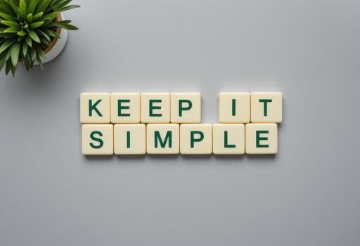 Keep It Simple Message with Green Letters on Light Gray Background photo