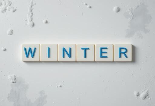 Creative Winter Concept with Letter Tiles on Snowy Background photo