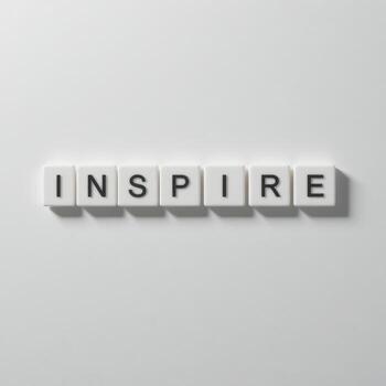 Inspire Message with Alphabet Tiles on a Clean and Simple Background photo
