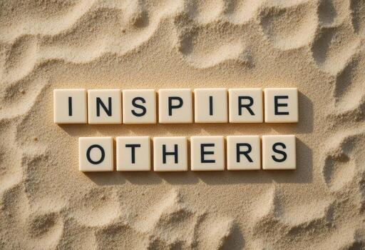 Inspiring Message with letter tiles Letters on Sandy Beach Background photo