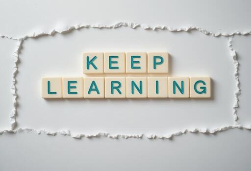 Keep Learning Motivational Message on Torn Paper Background for Inspiration photo