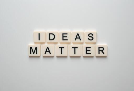 Ideas Matter Motivational Message with Alphabet Tiles on a Simple Background photo
