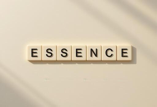 Concept of Essence Represented with Letter Blocks on Beige Background photo