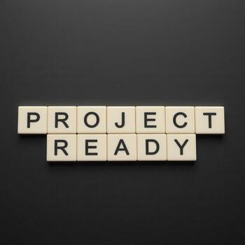 Project Readiness Concept with Alphabet Tiles on a Black Background photo