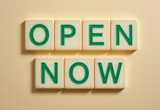 Eye-Catching Open Now Sign in Bright Green Letters on Soft Background photo