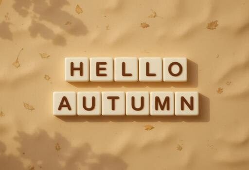 Hello Autumn Message with Letter Blocks on a Soft Beige Surface photo