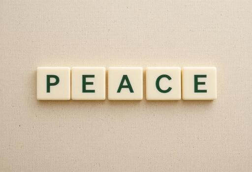 Peace Word in Green Letters on a Beige Background for Calm and Harmony Themes photo