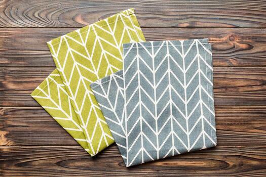 top view with blue kitchen napkin isolated on table background. Folded cloth for mockup with copy space,Minimal style photo