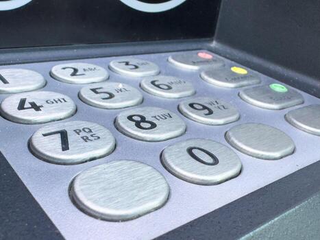 Close-up image of atm keypad with numeric buttons photo