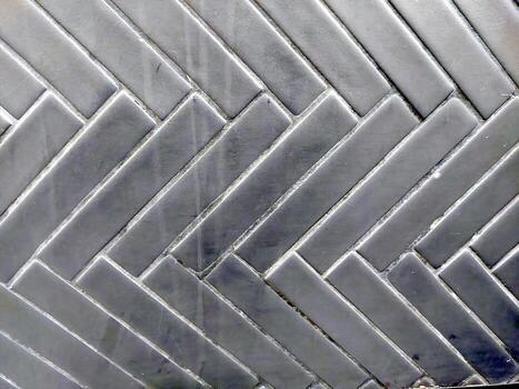 Black Zigzag Tile Pattern With Glossy Finish Ideal for Modern Interior Design Projects photo