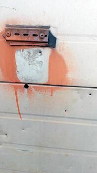 Old Wall Panel Mount With Paint Stains and Distressed Texture Showcasing Age and Wear photo