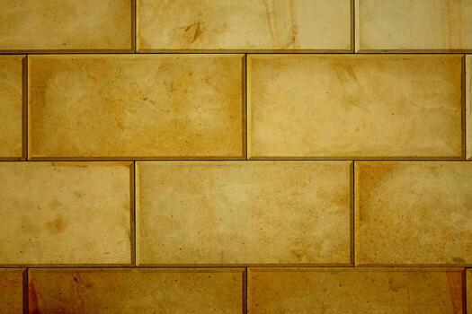 Orange tiles with horizontal rows of brownish rectangles on the wall photo