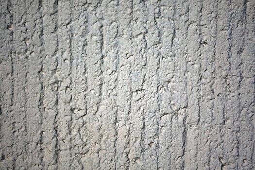 Texture of base layer of gray plaster. Stripes and groove photo