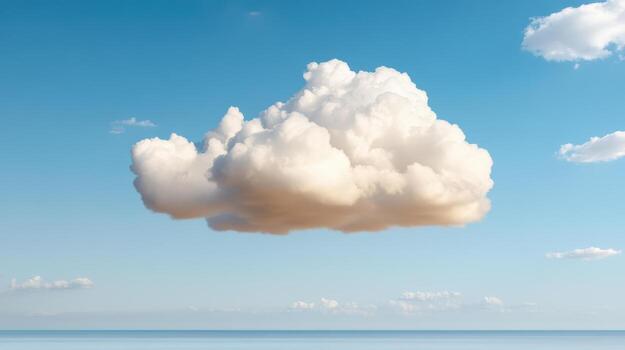 A cloud floating in the sky over the ocean photo
