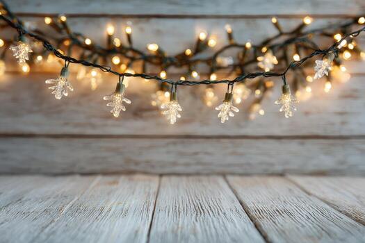 Decorative string lights with clear bulb covers are elegantly draped across a rustic wooden background, creating a warm and inviting atmosphere for festive occasions photo