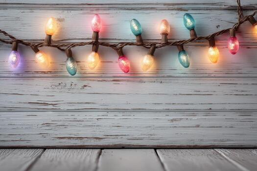 Colorful string lights are illuminated against a rustic wooden background, creating a warm and inviting atmosphere perfect for festive celebrations and gatherings photo