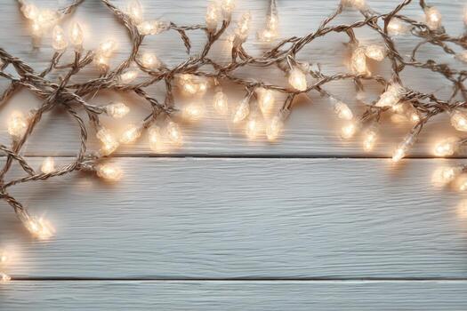 Decorative string lights with warm glowing bulbs are artistically arranged on a rustic wooden surface, creating a cozy and inviting atmosphere for festive celebrations photo