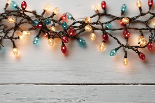 Colorful string lights with red, blue, and yellow bulbs are elegantly arranged on a rustic white wooden surface, creating a warm and festive atmosphere for celebrations photo