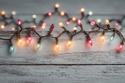 Colorful string lights with pink, blue, and yellow bulbs are elegantly arranged on a rustic wooden surface, creating a warm and inviting atmosphere for festive celebrations photo