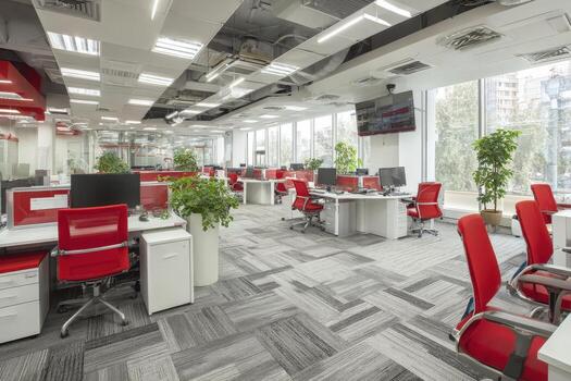 moderno oficina interior presentando espacioso diseño con rojo y blanco muebles, grande ventanas permitiendo natural luz, y verdor mejorando el profesional atmósfera y productividad foto