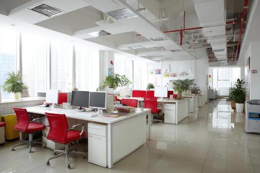 Modern office interior featuring bright red chairs and white desks, illuminated by natural light from large windows, creating a vibrant and productive workspace atmosphere photo