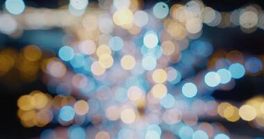 jul defocused is skridskoåkning rink bokeh bakgrund. skimrande abstrakt värma cirklar oskärpa. suddig fe- lampor. ut av fokus Semester bakgrund. ljus bokeh från video