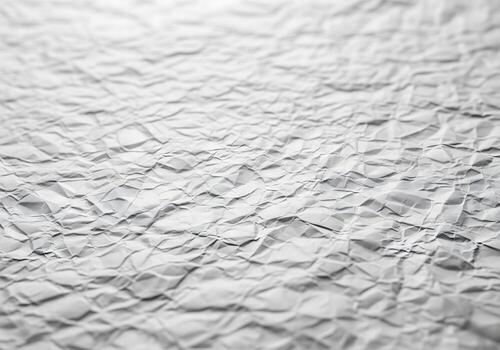 Crumpled white paper texture background with deep creases and shadows offering a distressed look ideal for design projects photo