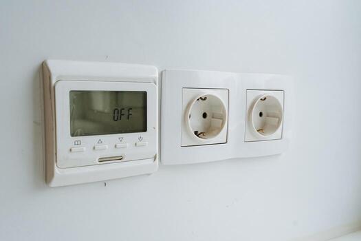 smart home controls, modern energy management display, contemporary thermostat with dual outlets and lcd screen, advanced smart home system featuring dual outlets and lcd display photo