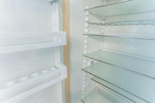 highresolution image showcasing refrigerator glass shelf with support rails and sleek modern design photo
