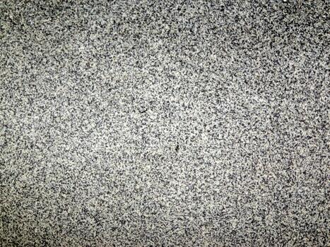 The surface is a textured gray that features intricate and detailed patterns throughout photo