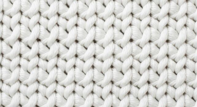 Elegant white knitted textile background, featuring a detailed macro view of the cozy, soft yarn weave and beautiful texture, ideal for design elements photo