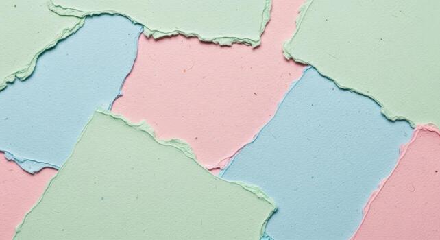 Soft pastel colored ripped paper layers creating an abstract and delicate textured background for creative designs and artistic projects photo