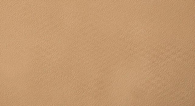 High-resolution photograph of a light brown synthetic leather texture, a versatile beige background with a fine grain pattern photo