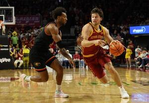 Iowa State Cyclones guard Nate Heise (0) is defended by Grambling State Tigers forward Roderick Coffee III (1) during the first half at James H. Hilton Coliseum. editorial_image